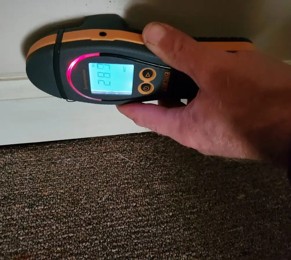 Moisture detection at baseboard during Storm Damage Restoration in Naugatuck